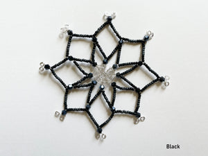 Festive black ornament, handmade wired snowflake Christmas tree ornament with matte and shiny black and dark gray beads. Silver wired spiderweb design in middle.