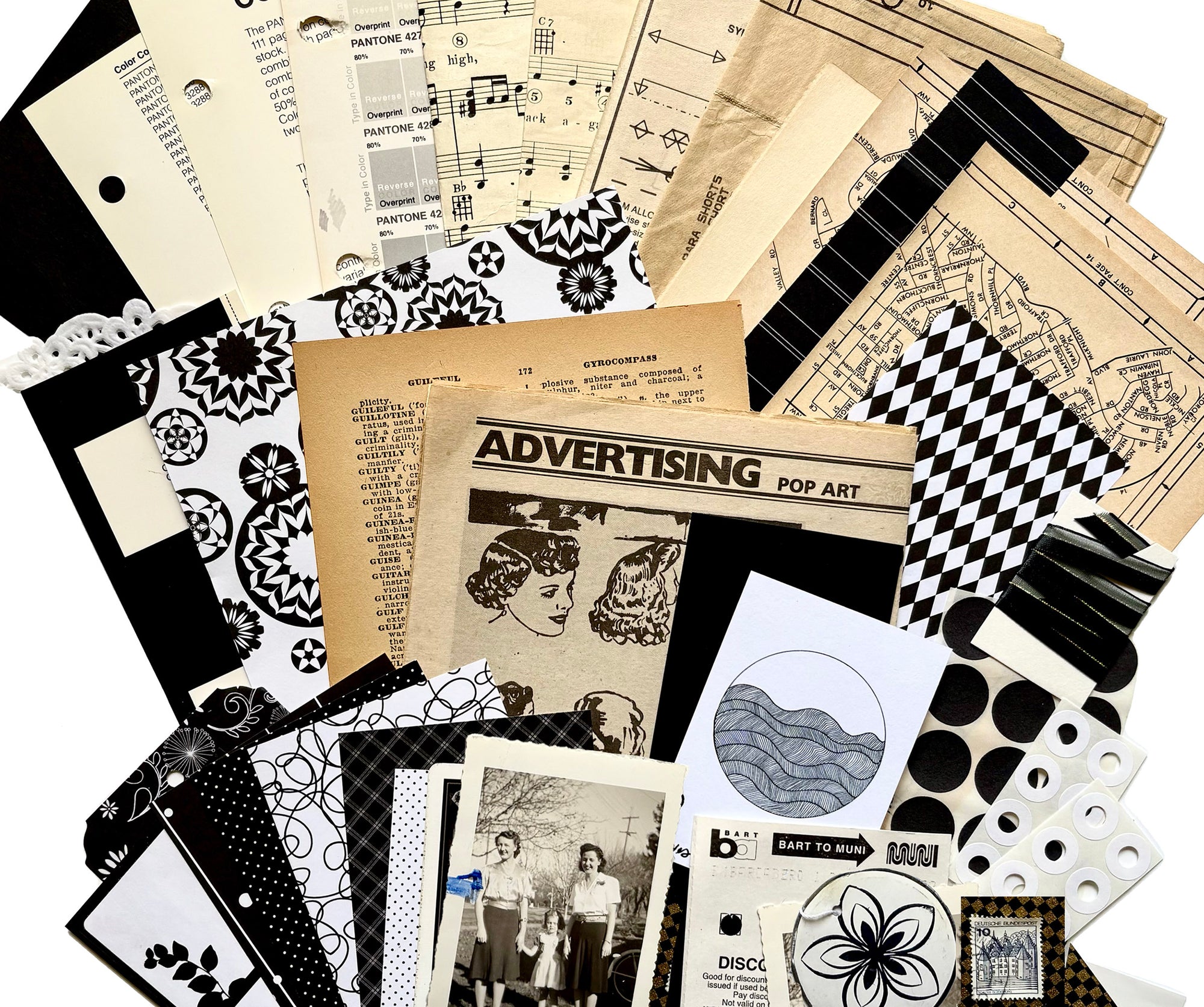 Example of what types of items are in junk journal kit, showing vintage text papers, sheet music, old maps and newspapers, decorative papers, scrapbook and card stock papers, mini art print, cancelled stamps, hang tags, old photographs, doilies, stickers, ribbon, bus transfers, etc., all shown in the black and white pack. 