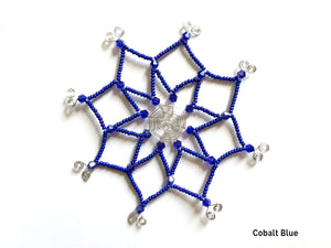 Snowflake ornament made with sparkling cobalt blue vintage glass beads with hand cut silver wire. This unique ornament makes a lovely addition to your Christmas decor.