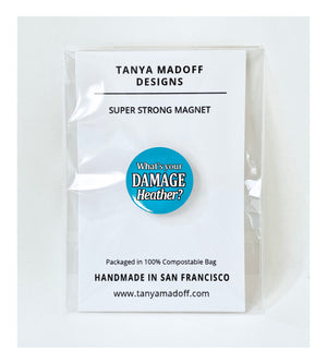 What’s Your Damage Heather? one inch extra strength magnet, packaged on recycled paper, in 100% compostable clear glassine bag