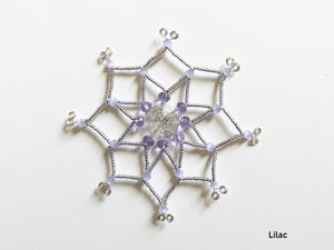 Beaded snowflake ornament, silver wire cut and bent by hand, delicately beaded with purple and lilac glass beads in unique design.