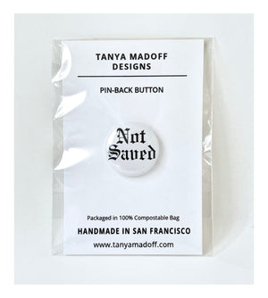 Not Saved 1" Pin-back button, packaged on recycled paper, in 100% compostable clear glassine bag