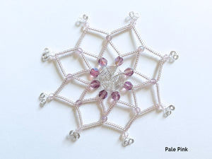 Pastel pink snowflake Christmas ornament, unique and handmade, silver wire cut and bent by hand with shiny and matte frosted vintage beads.