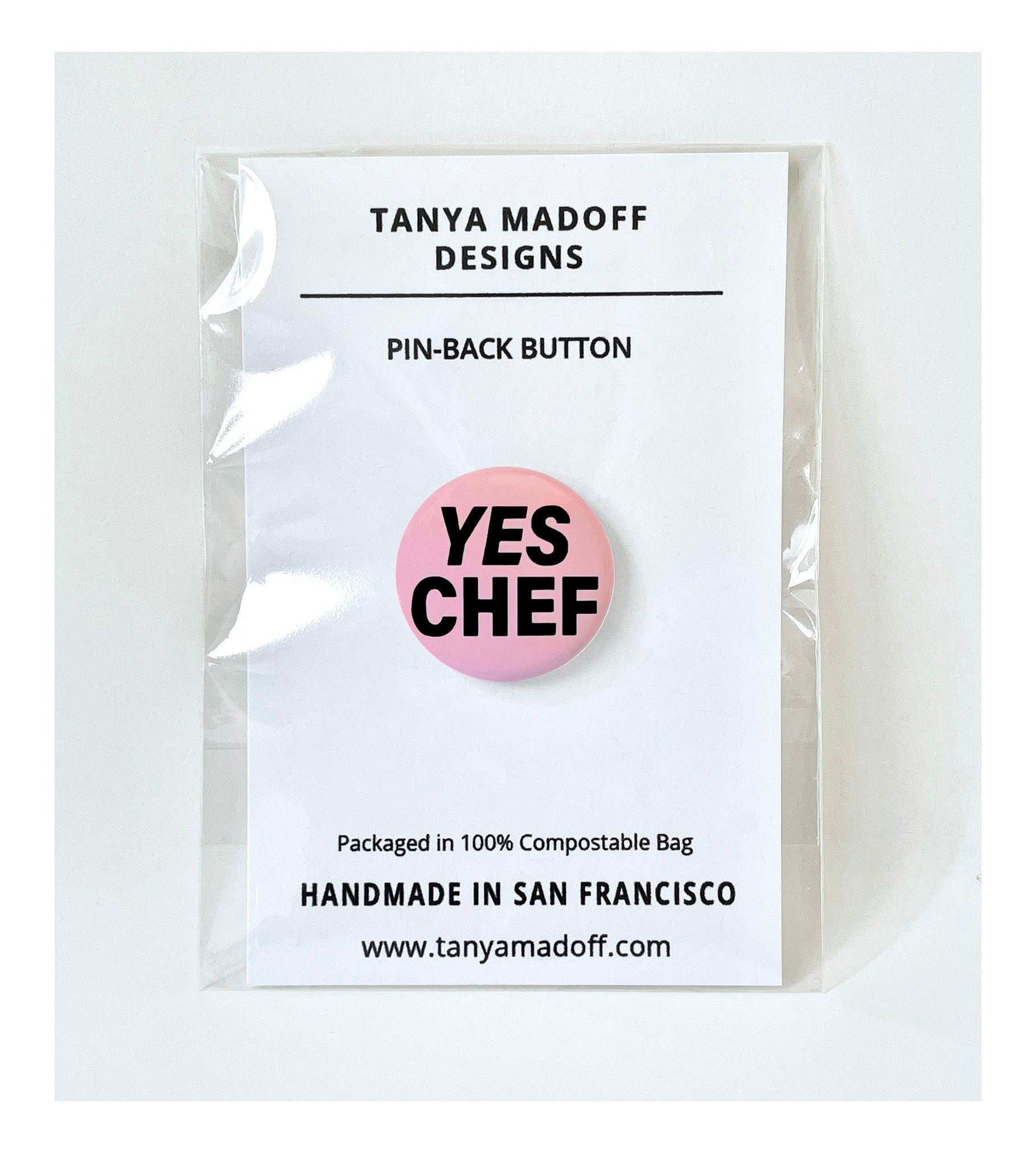 Yes Chef one inch pinback button (badge) shown packaged in compostable clear bag.